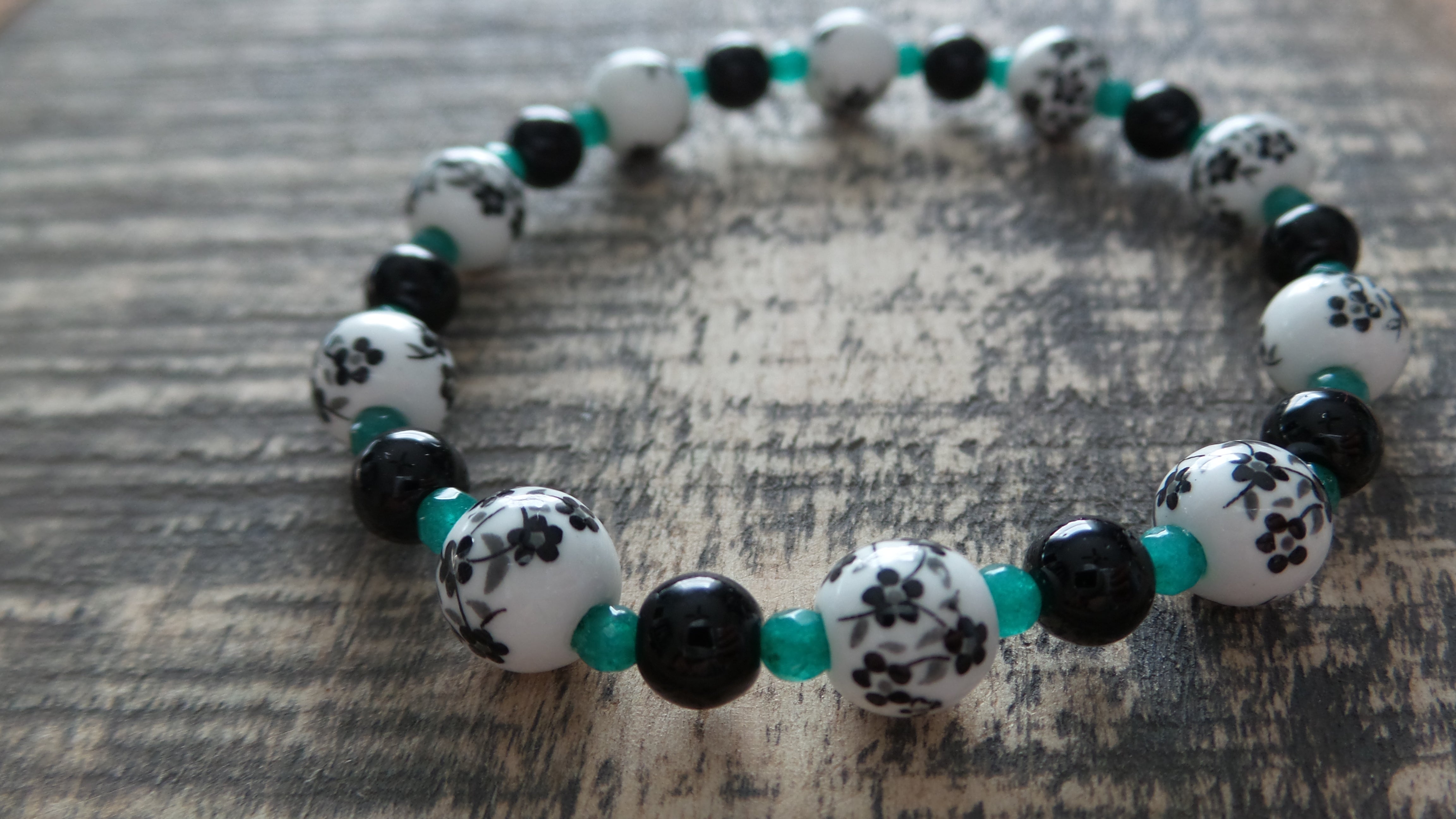 Bracelet- Black and White Floral Glass with Black and Teal Accents