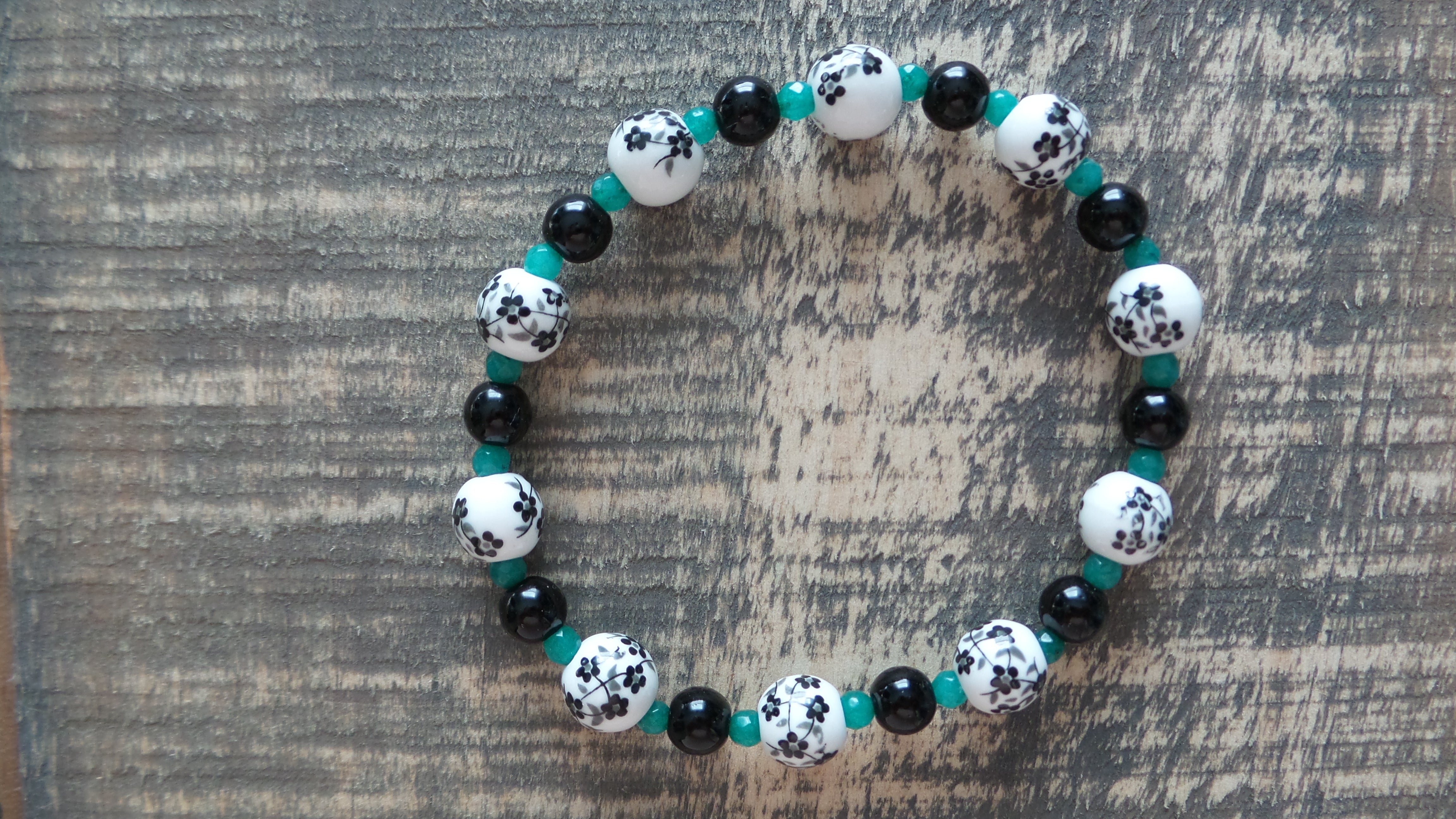 Bracelet- Black and White Floral Glass with Black and Teal Accents