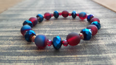 Bracelet- Iridescent Red with Red and Blue Faceted Rondelles